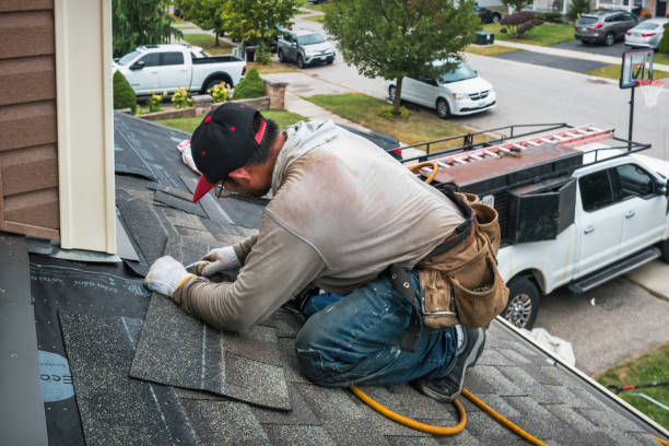 Professional Storm Damage Roof Repair technician working in Canton, MA